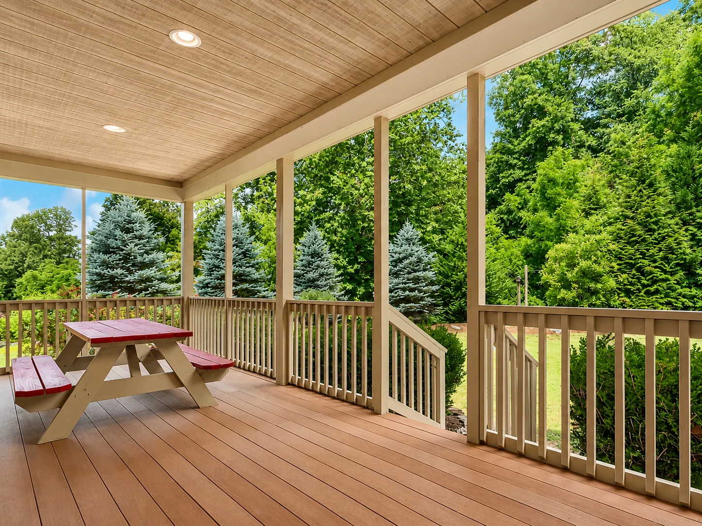 The covered back deck at 122 Twin Courts overlooking the garden